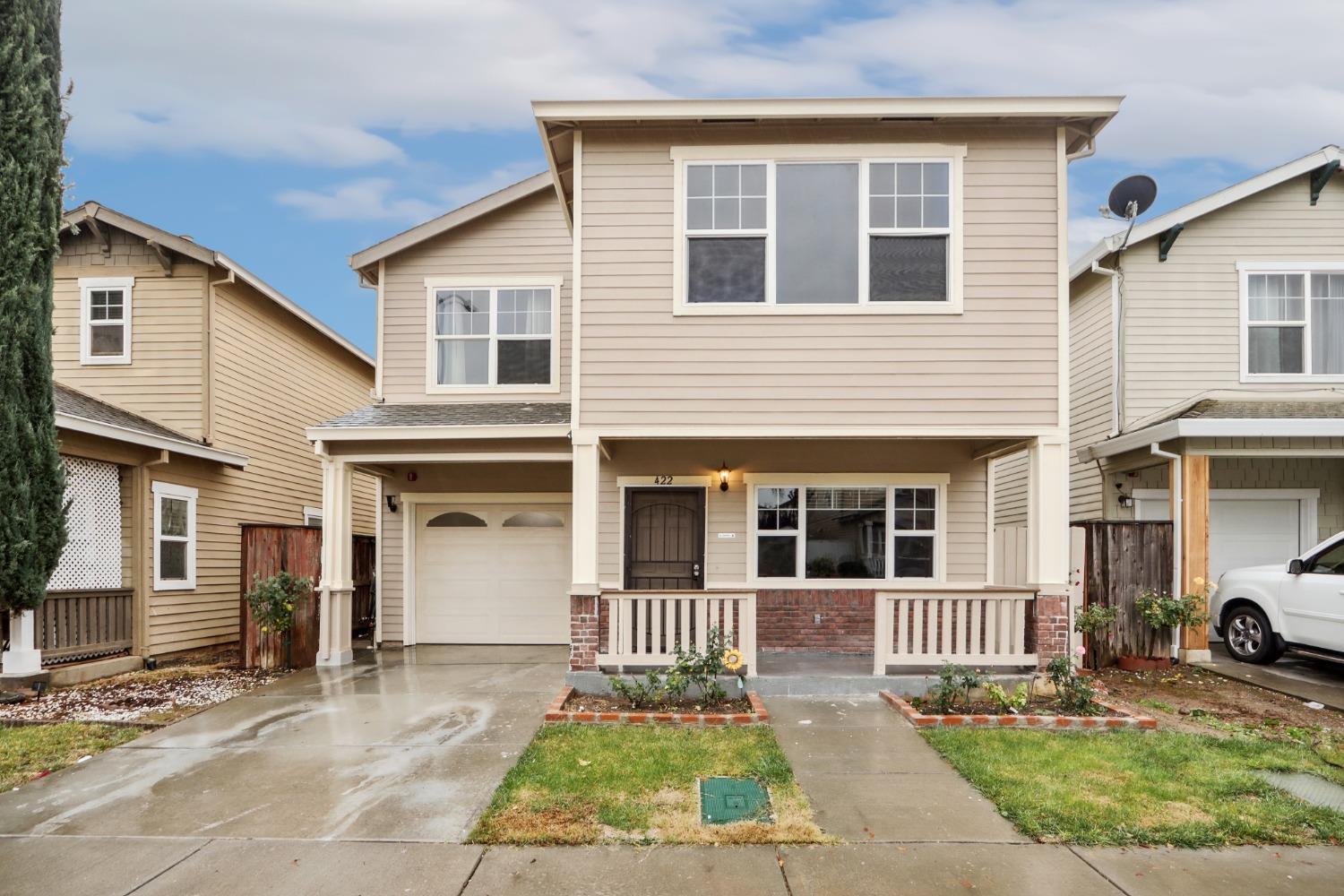 a front view of a house with a yard