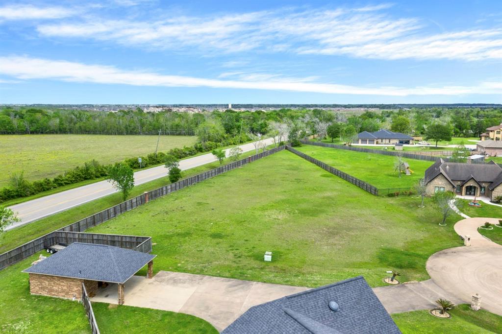 a view of a garden with lawn chairs