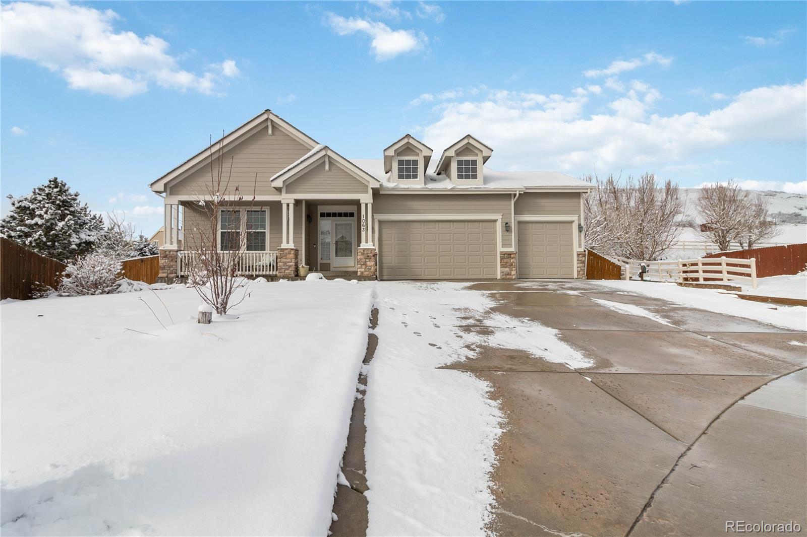 a view of a house with a snow on the road