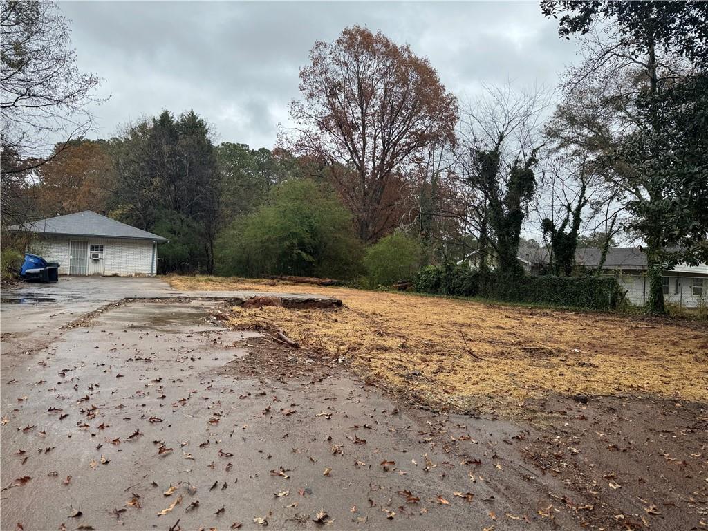 a backyard of a house with large trees