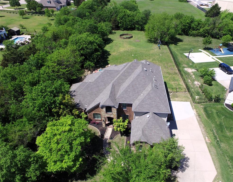 an aerial view of a house with a garden