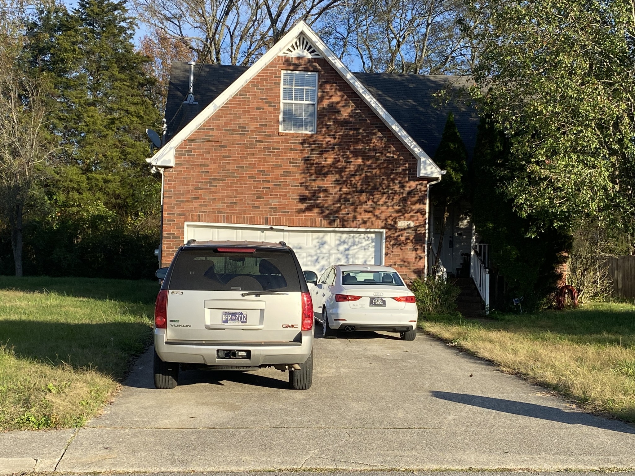 a view of car parked in front of house