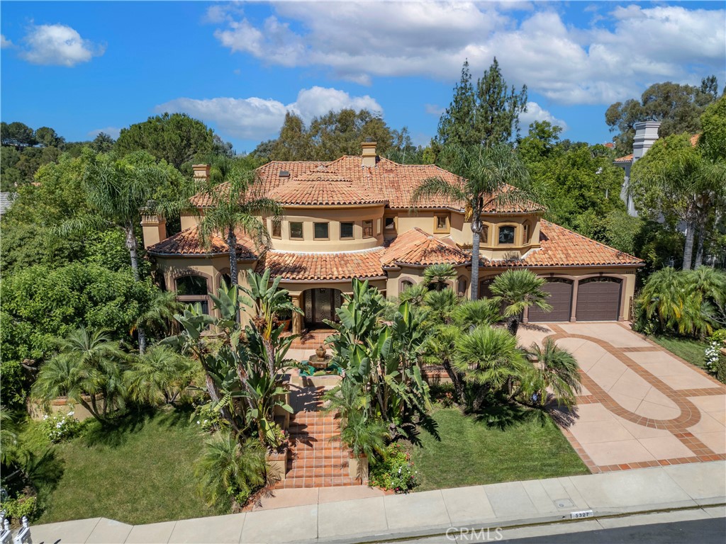 a aerial view of a house with a yard