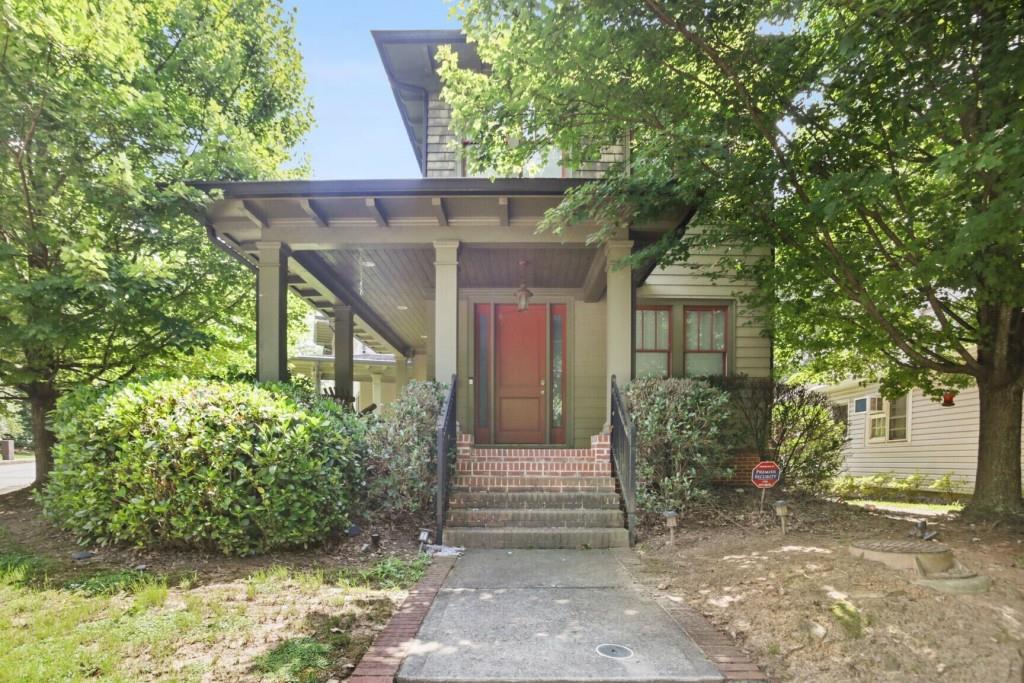 a view of a house with a tree