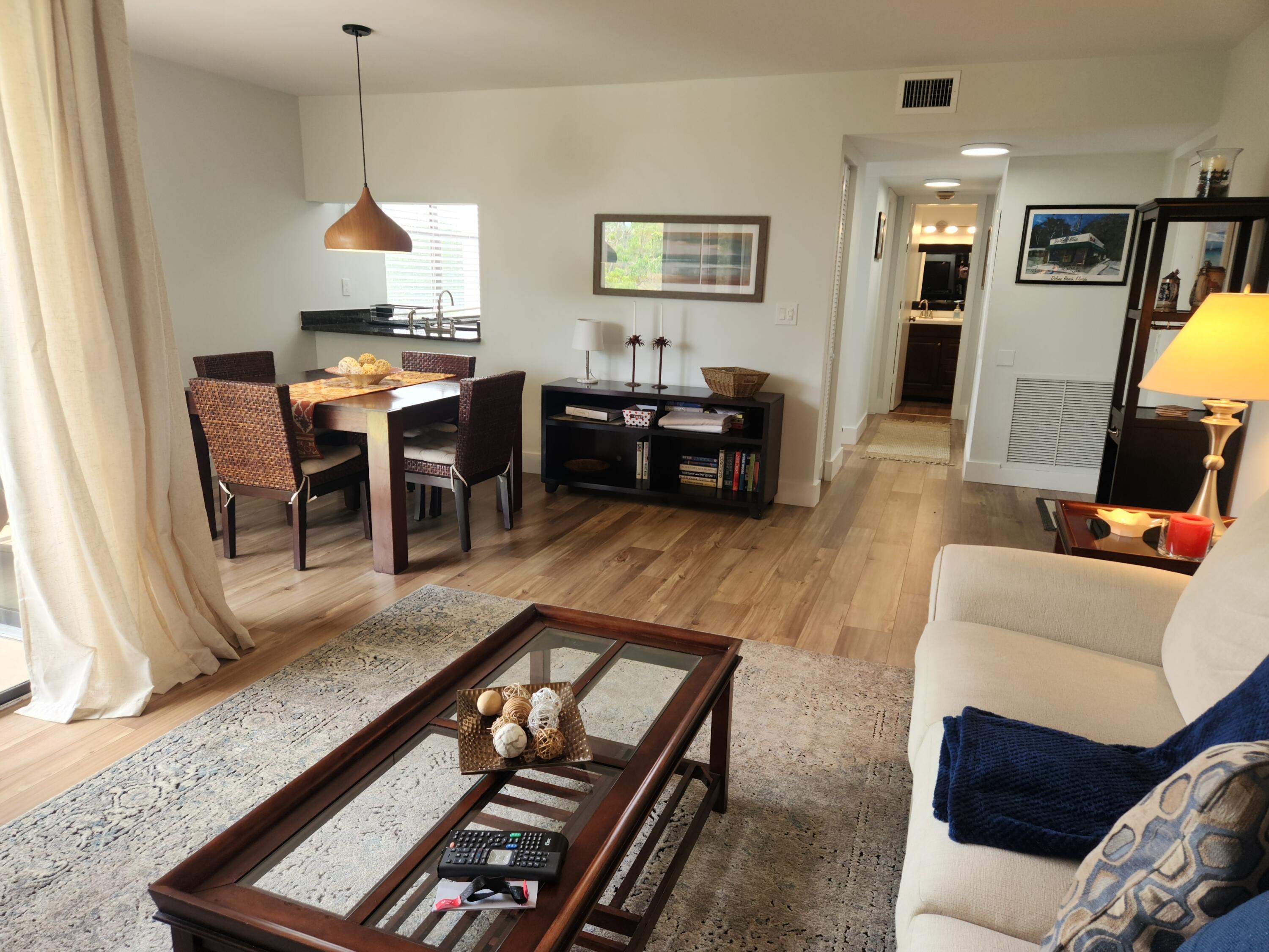 a living room with furniture fireplace and a flat screen tv