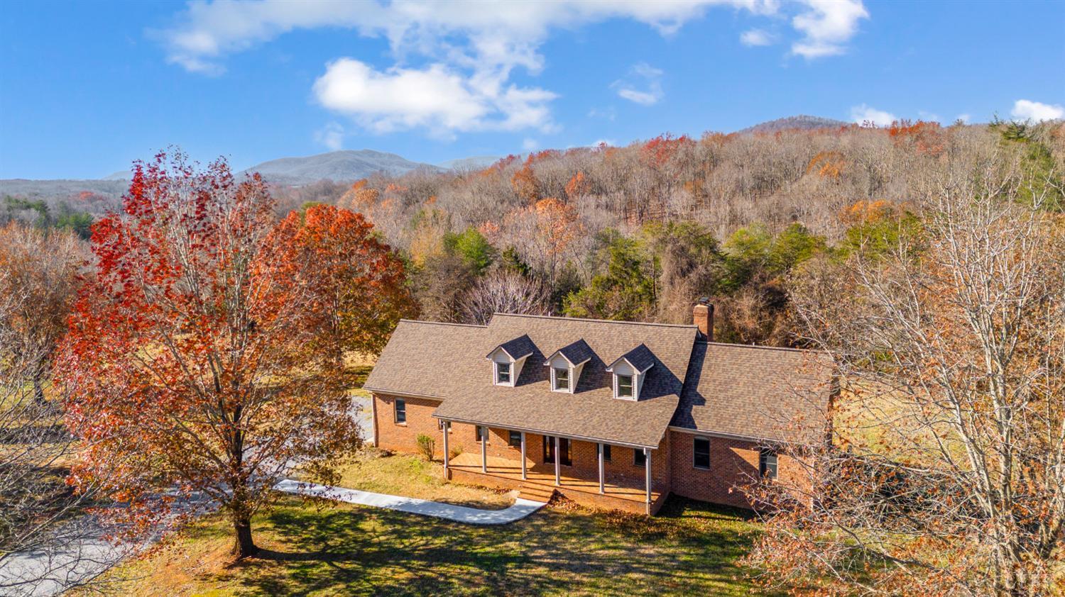 a view of a house with a mountain in the background