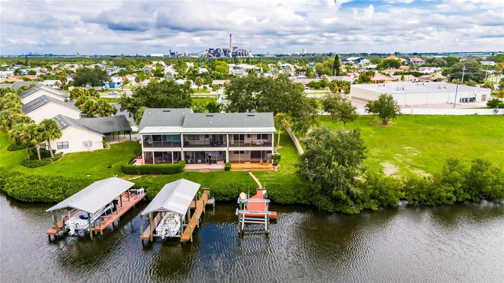 an aerial view of a house with swimming pool outdoor seating and yard