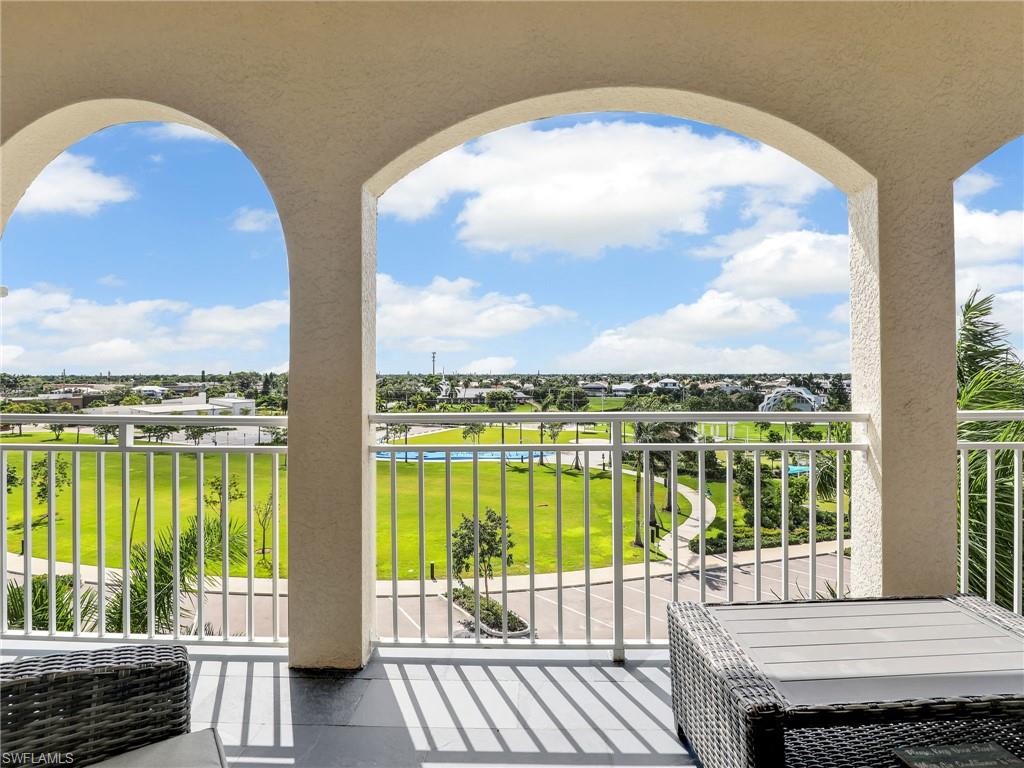 a view of a balcony with lake view and a ocean view