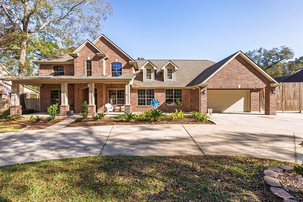 a front view of a house with yard and porch