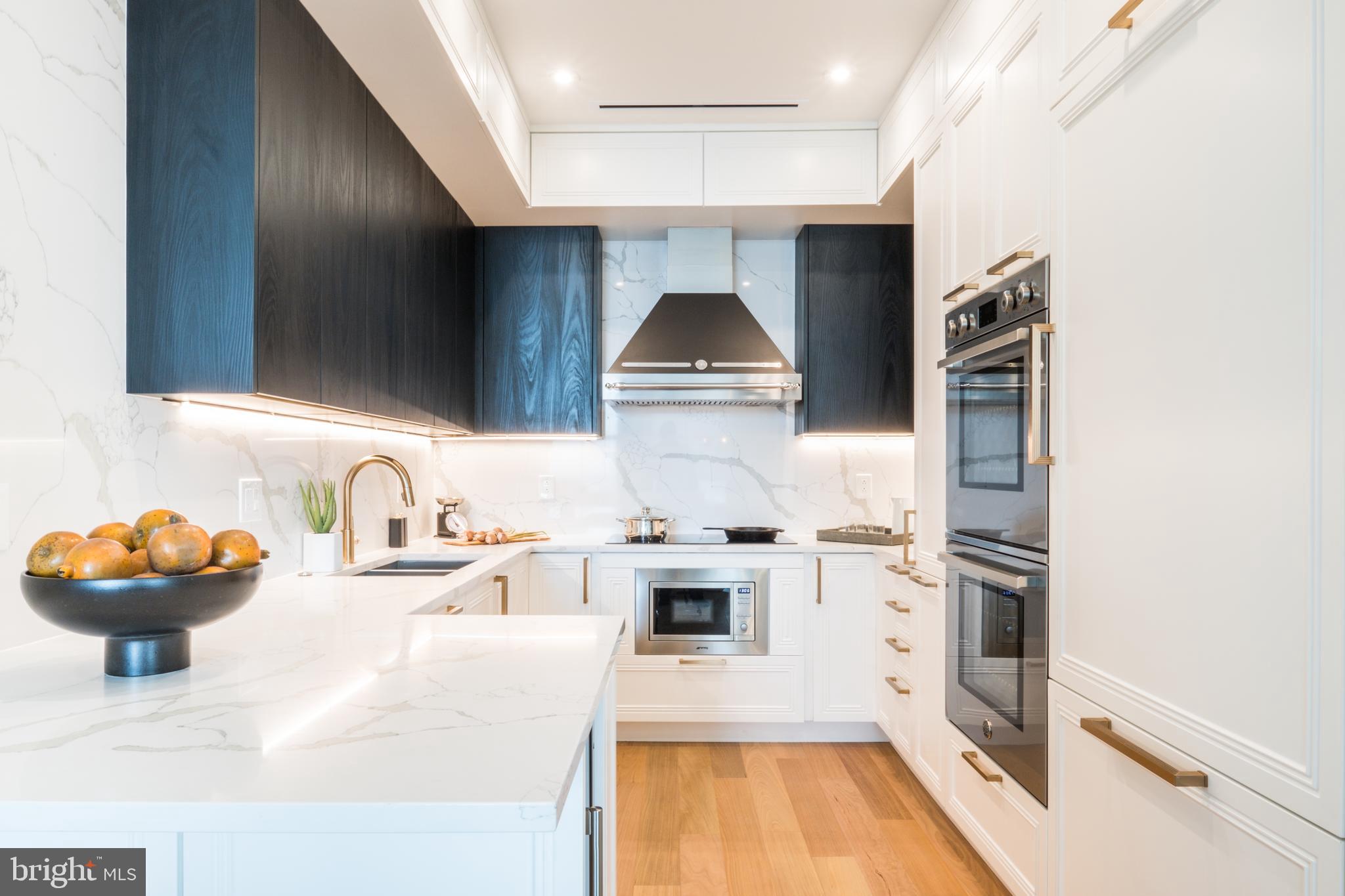 a kitchen with a sink and a stove