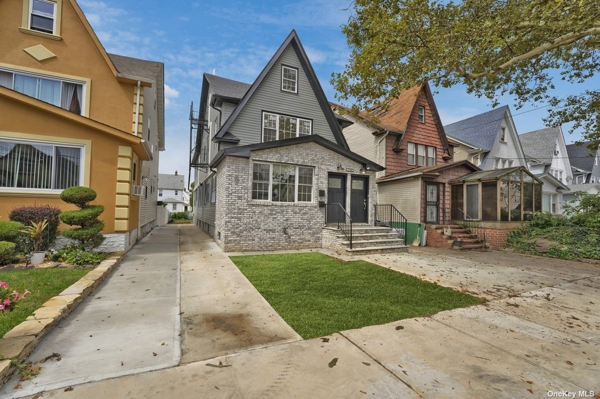 front view of a house with a yard