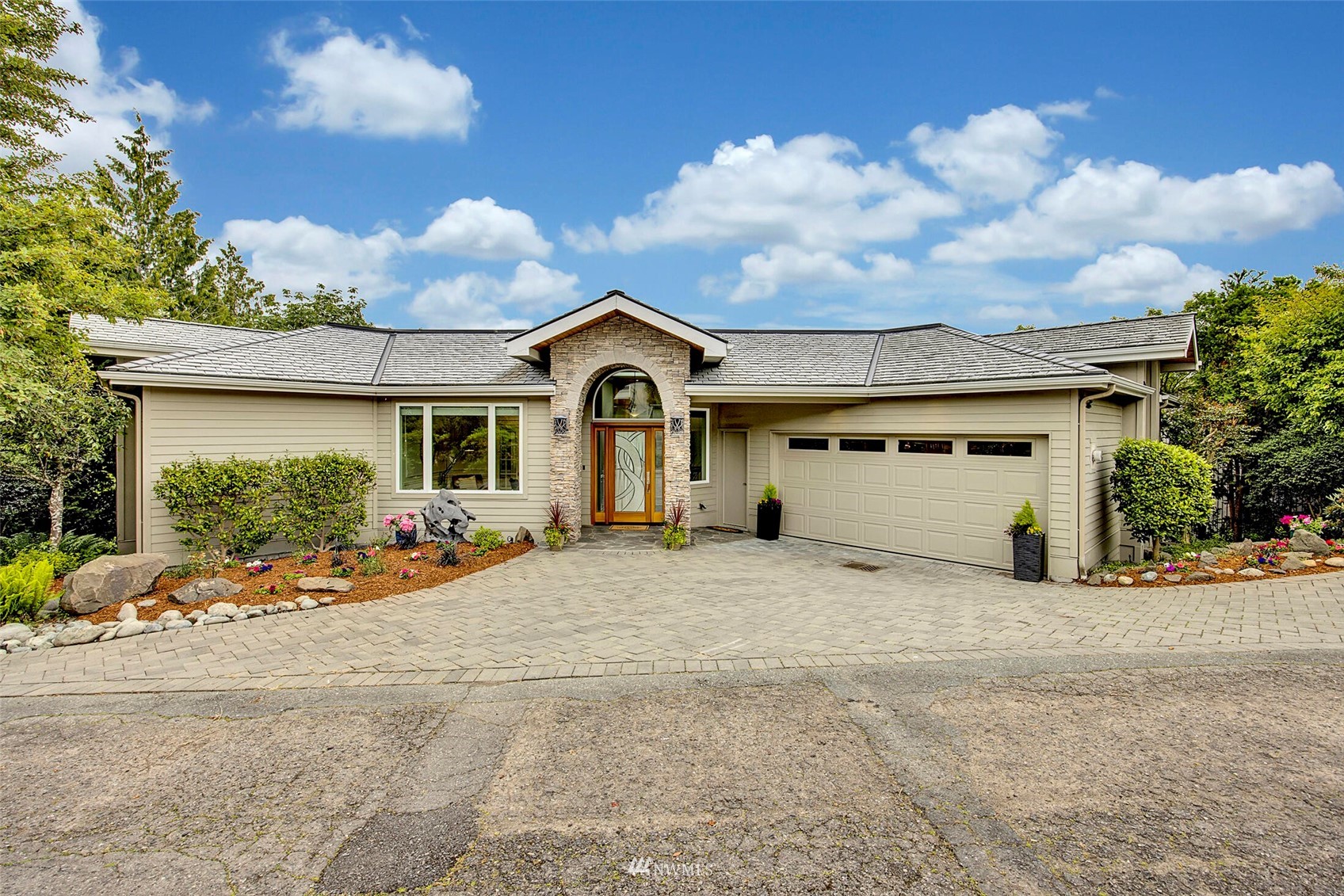 a view of a house with a yard and garage