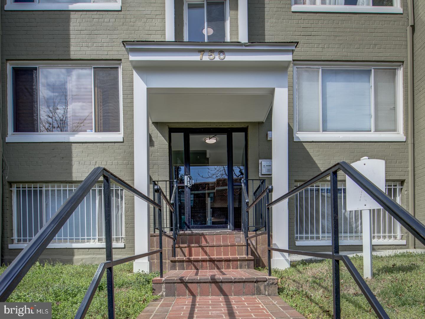 a view of front door of house with deck