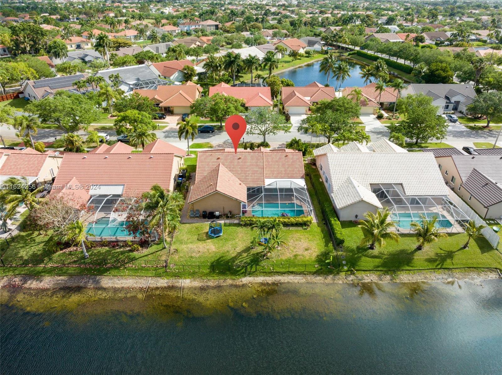 an aerial view of a houses with yard