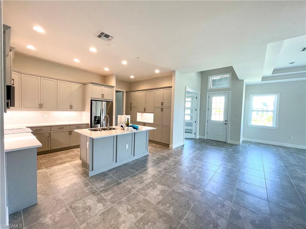 a large kitchen with cabinets