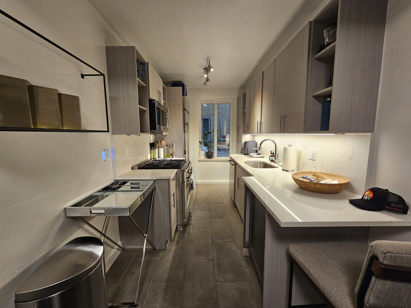 a kitchen with a sink cabinets and stove top oven