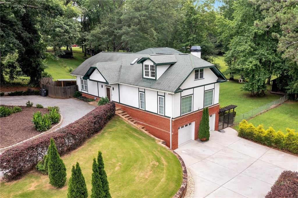 an aerial view of a house with swimming pool