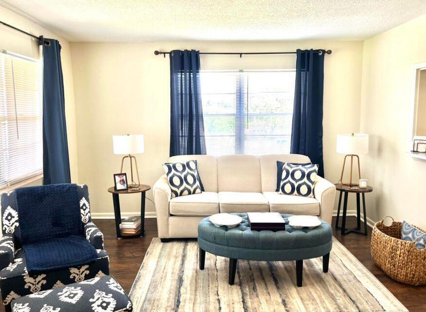 a living room with furniture and a large window