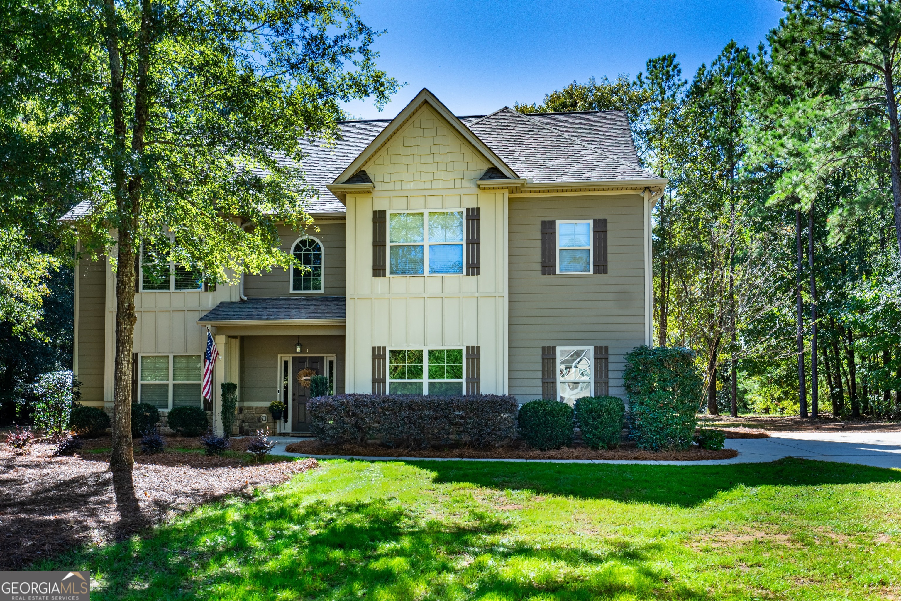 a front view of a house with a yard