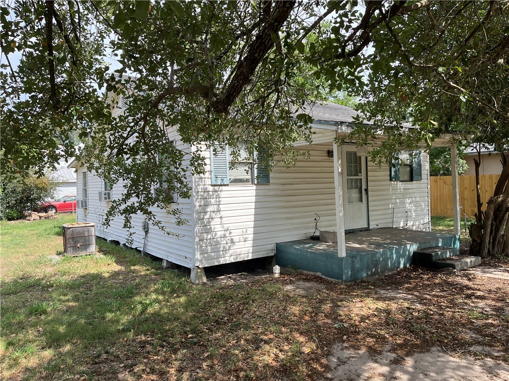 a view of a couches in backyard of house