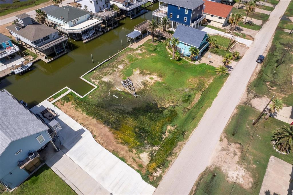 an aerial view of a house with a ocean view