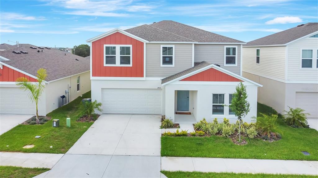 a front view of a house with a yard