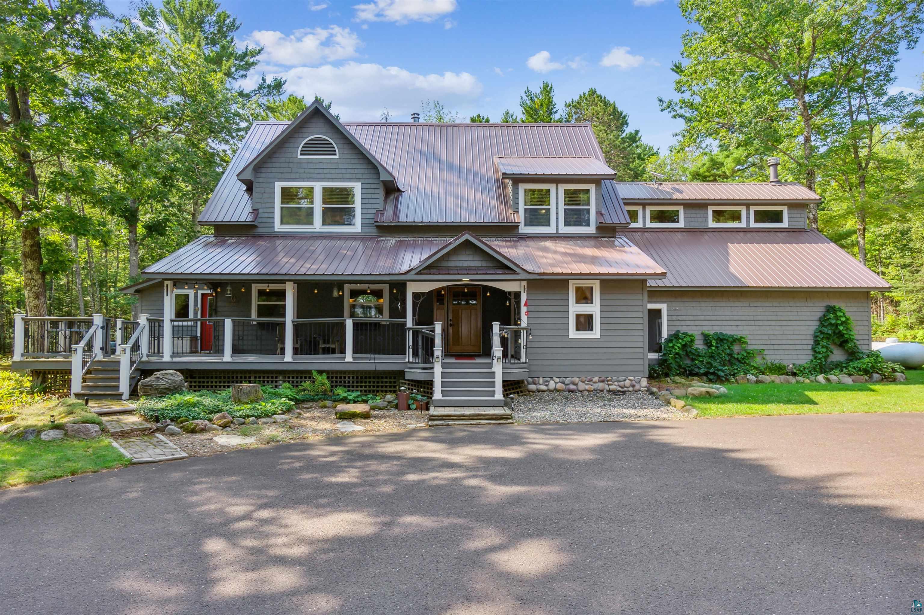 View of front of home featuring a large porch