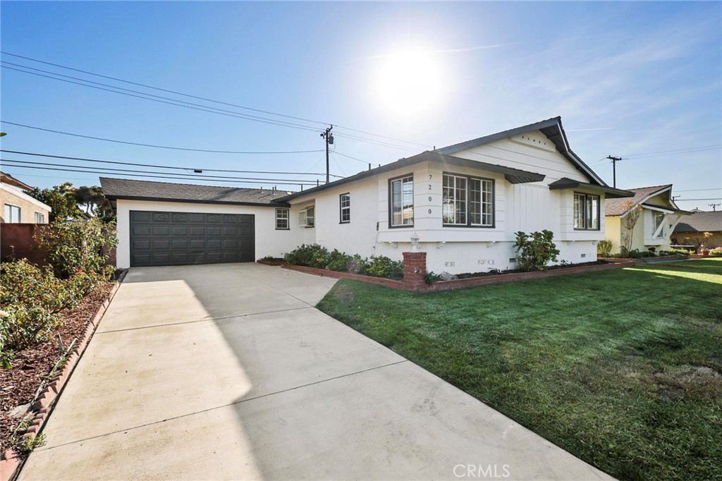 a view of a yard in front view of a house