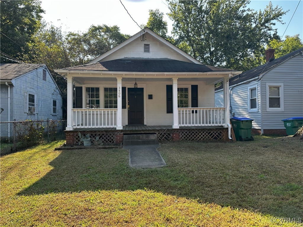 Bungalow-style house featuring a front yard and a