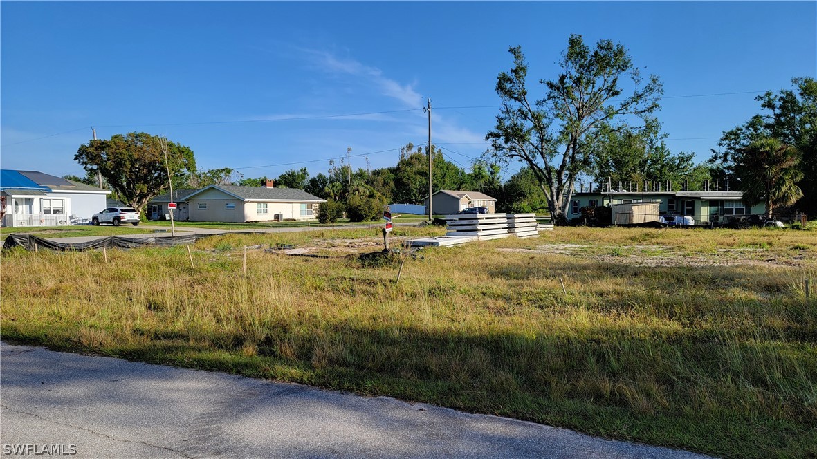 a view of a swimming pool with a yard