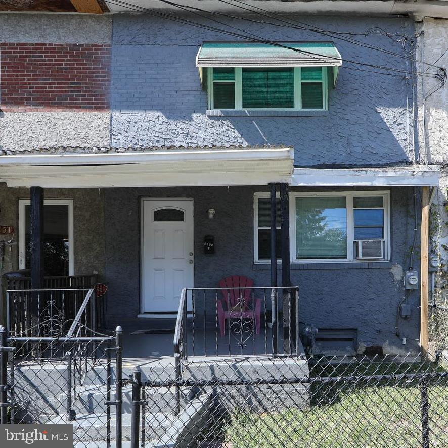 a front view of a house with yard