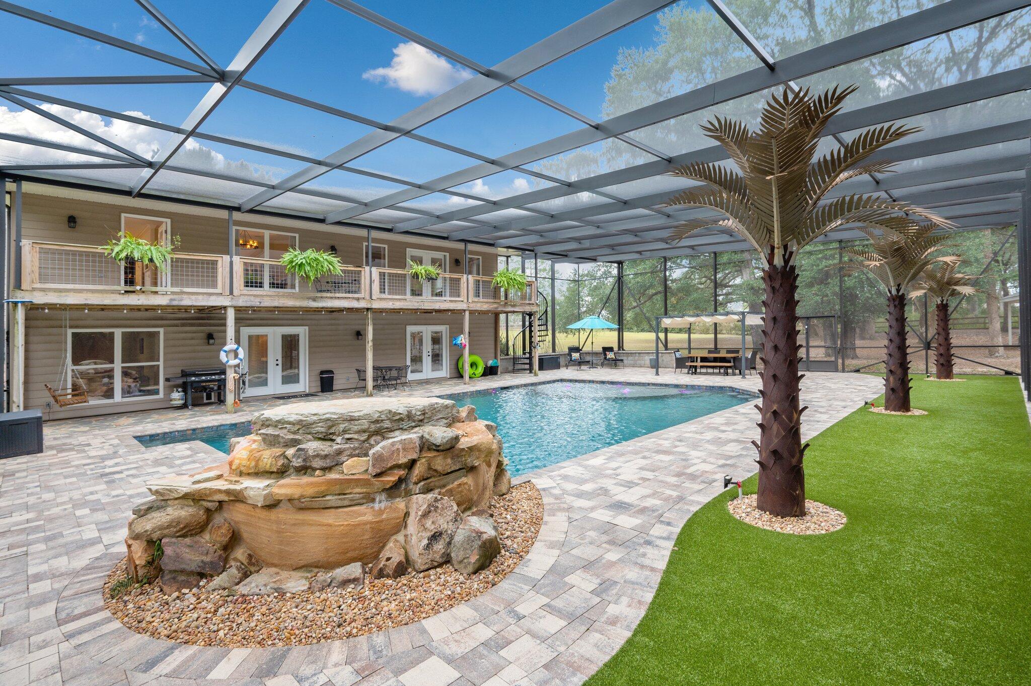 a view of a swimming pool with a yard