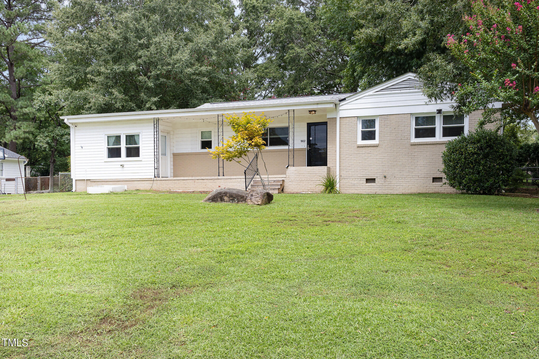 a front view of house with yard and seating area