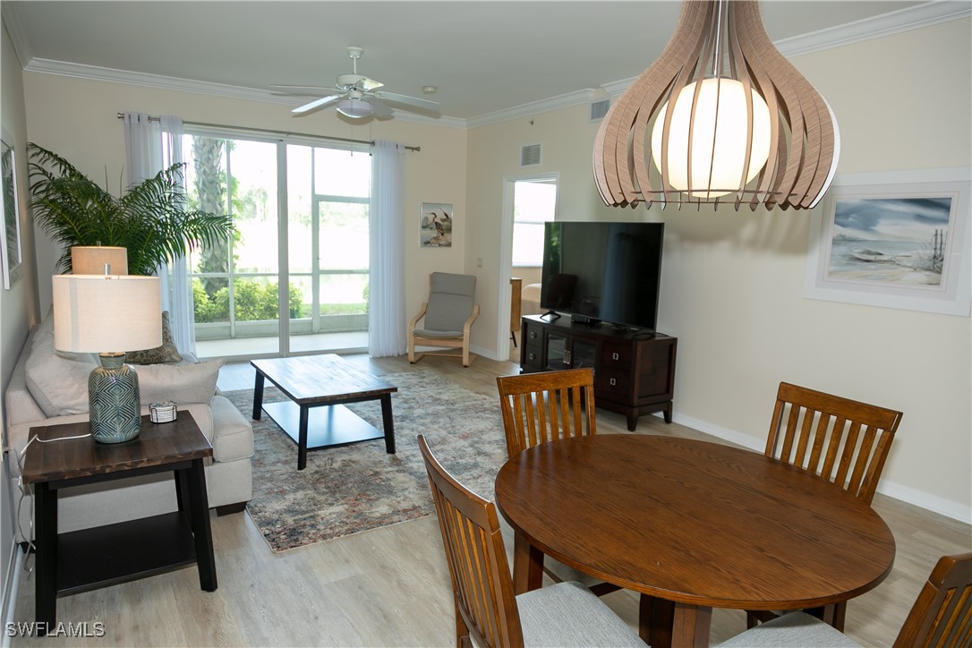 a view of a livingroom with furniture and a window