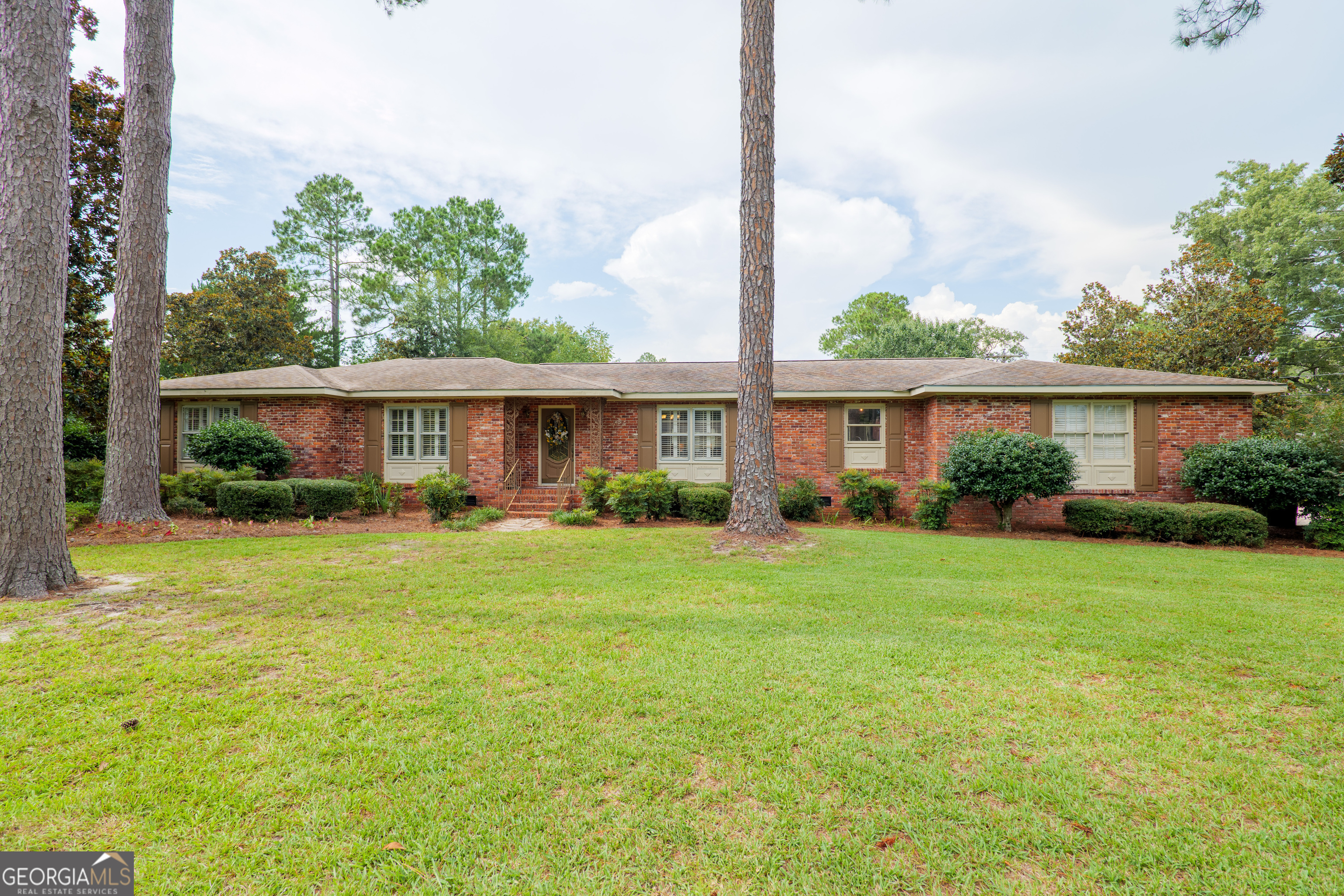 a front view of a house with a yard