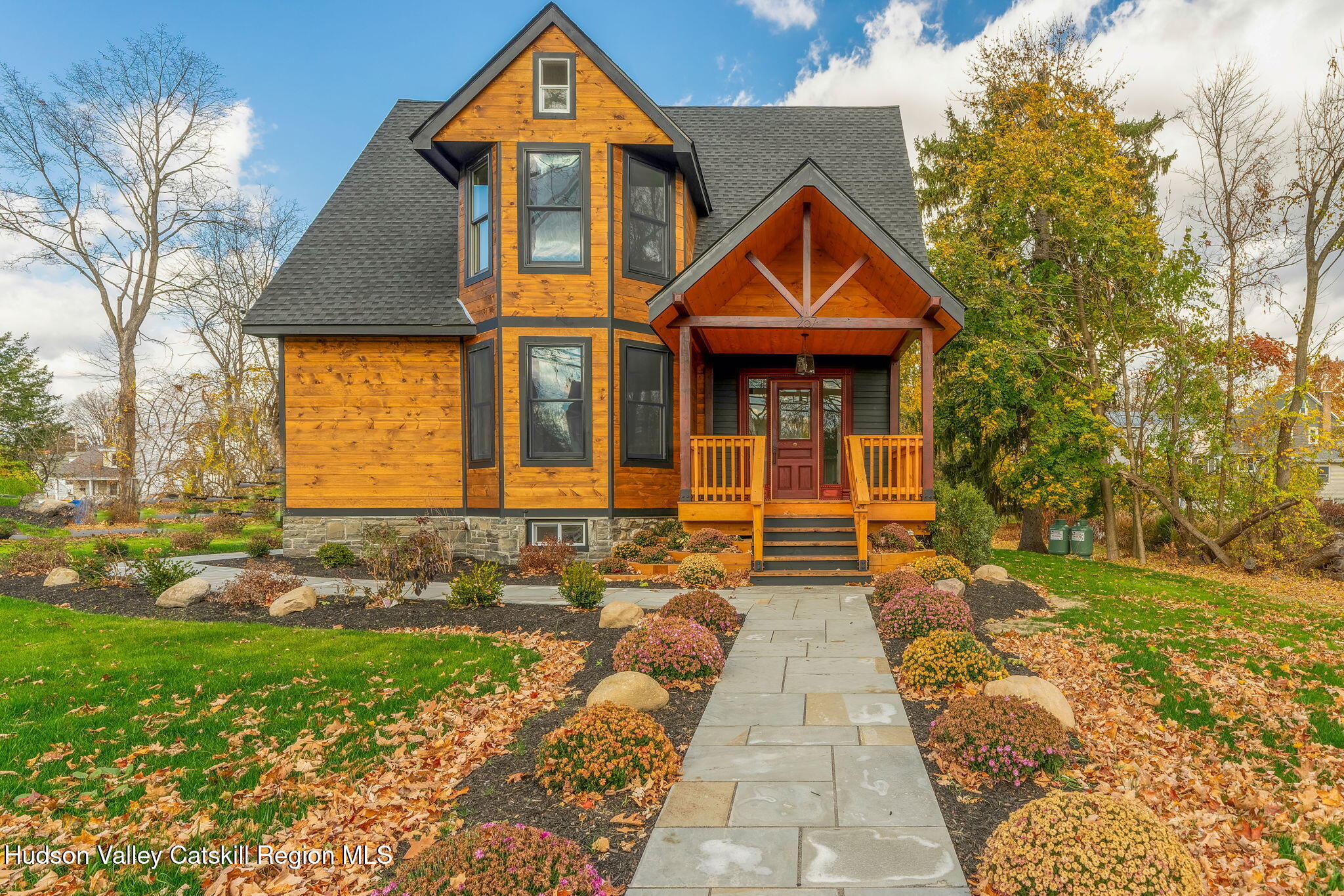 a front view of a house with garden