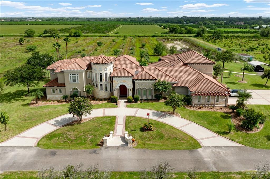 an aerial view of a house with garden