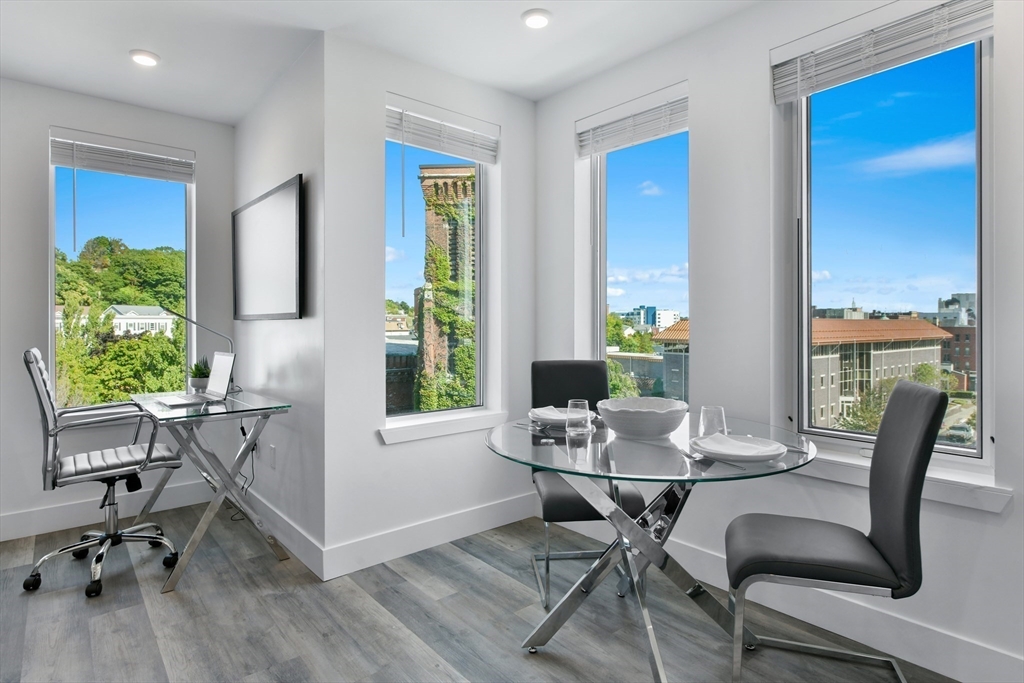 a work room with furniture and a window