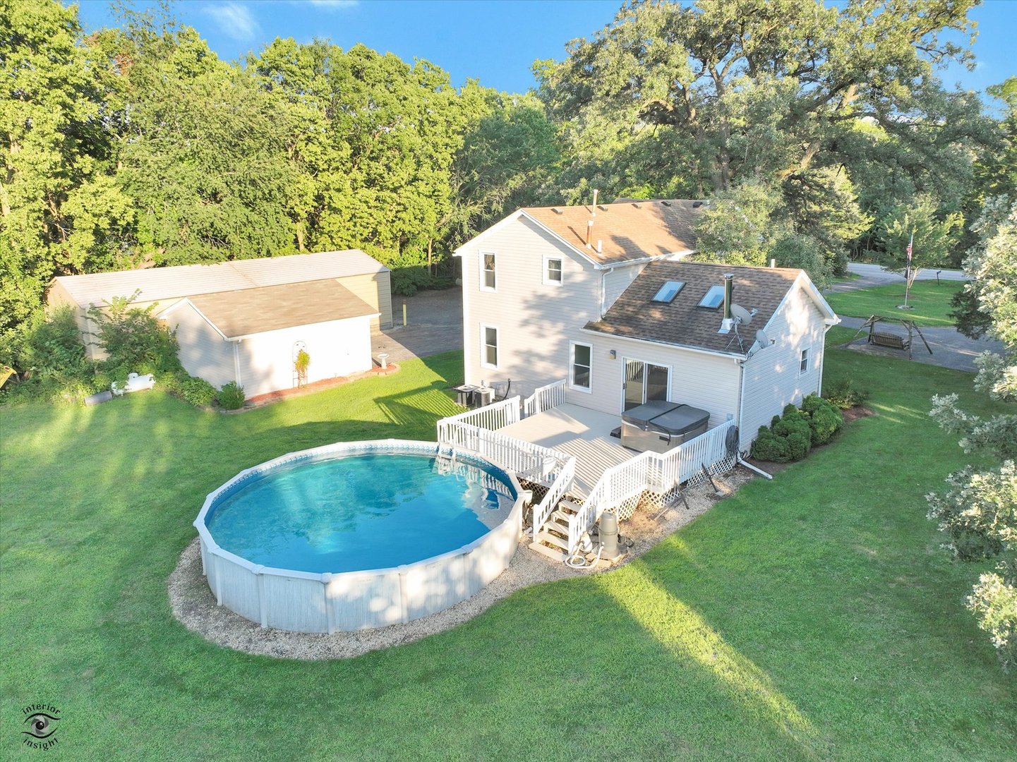 an aerial view of a house with outdoor space