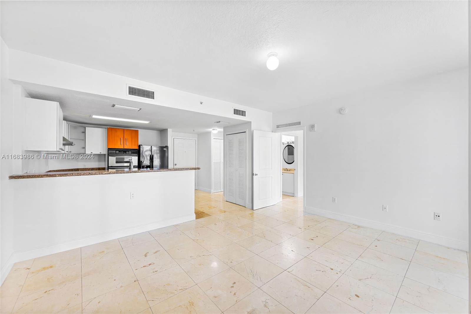 a view of kitchen and a window