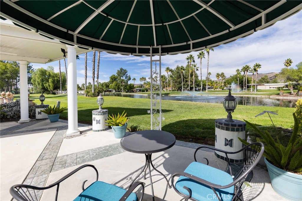 a patio with a yard table and chairs