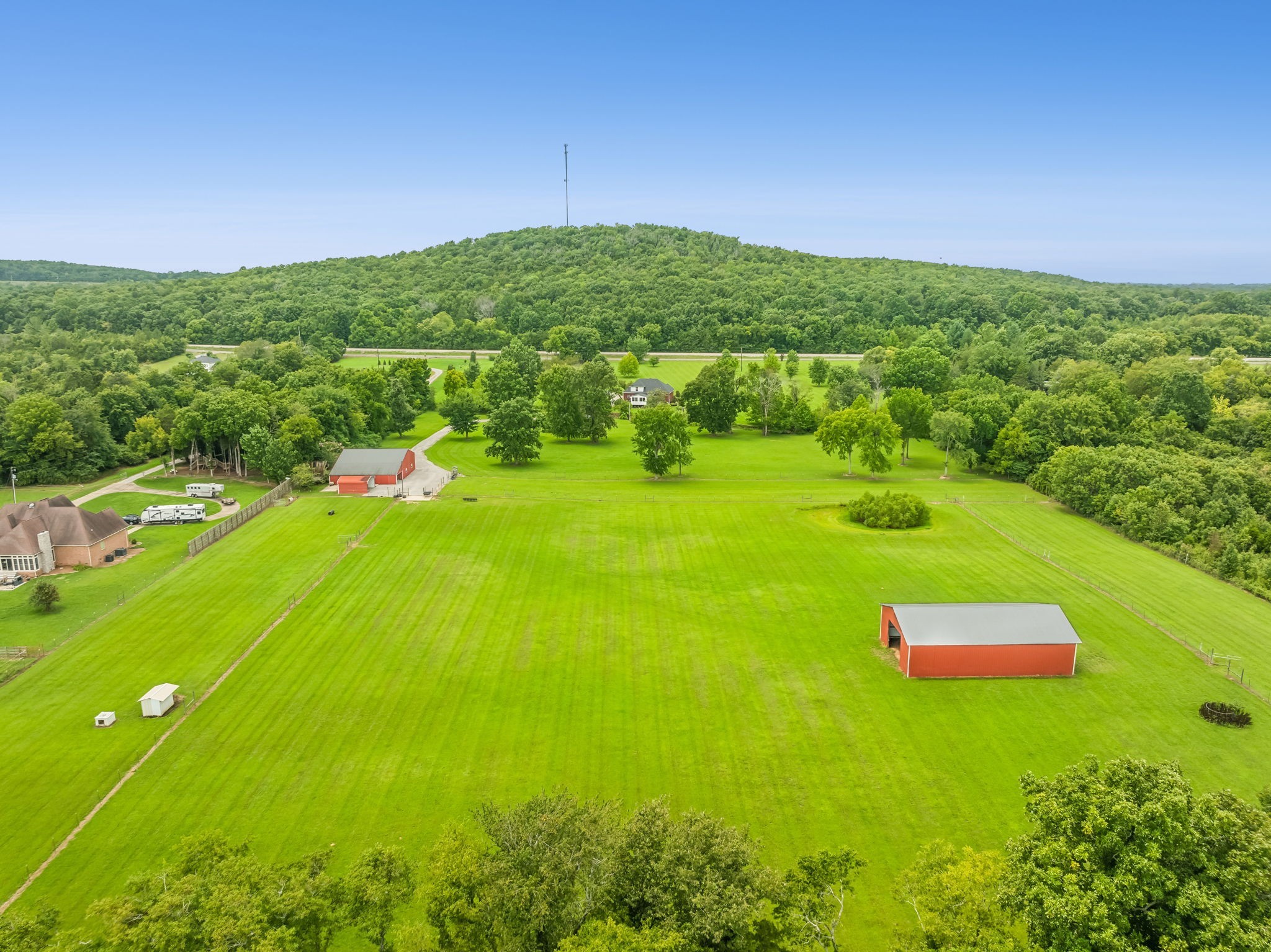 This property offers 16.5 acres of beautifully maintained land with a stunning home, providing the ideal setting for farm life while being conveniently close to the city luxuries of Murfreesboro!