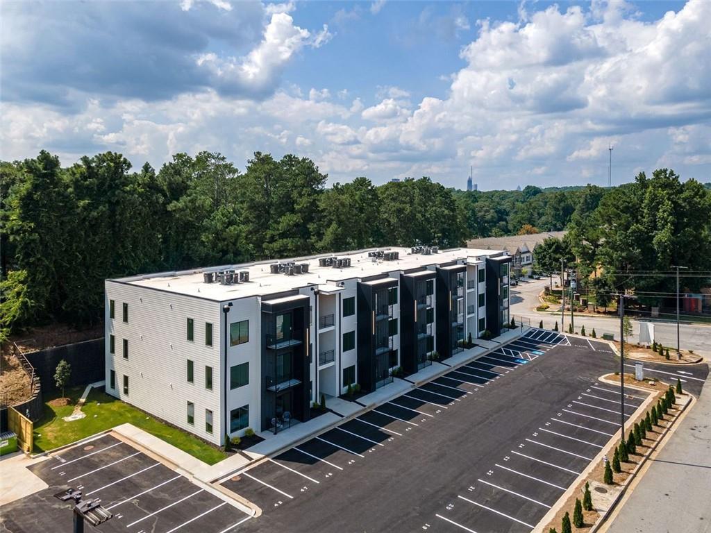 a view of a white building with a outdoor space