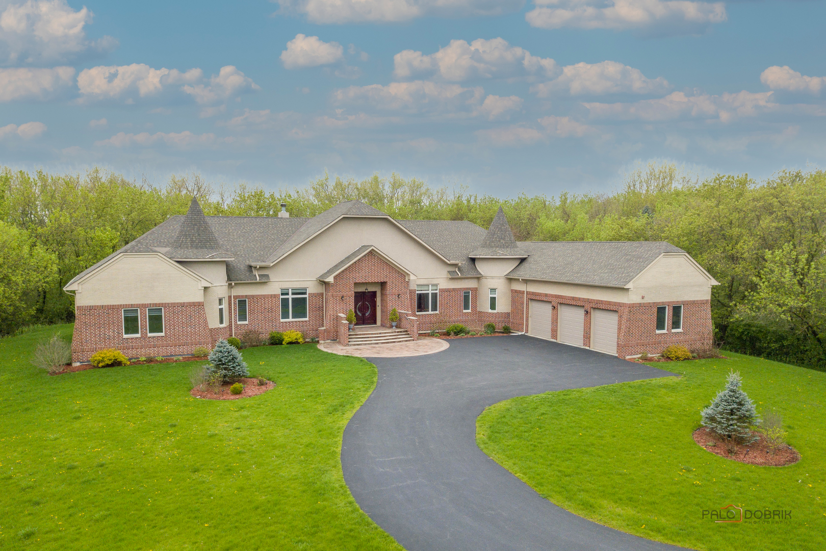 an aerial view of a house with swimming pool garden and fire pit