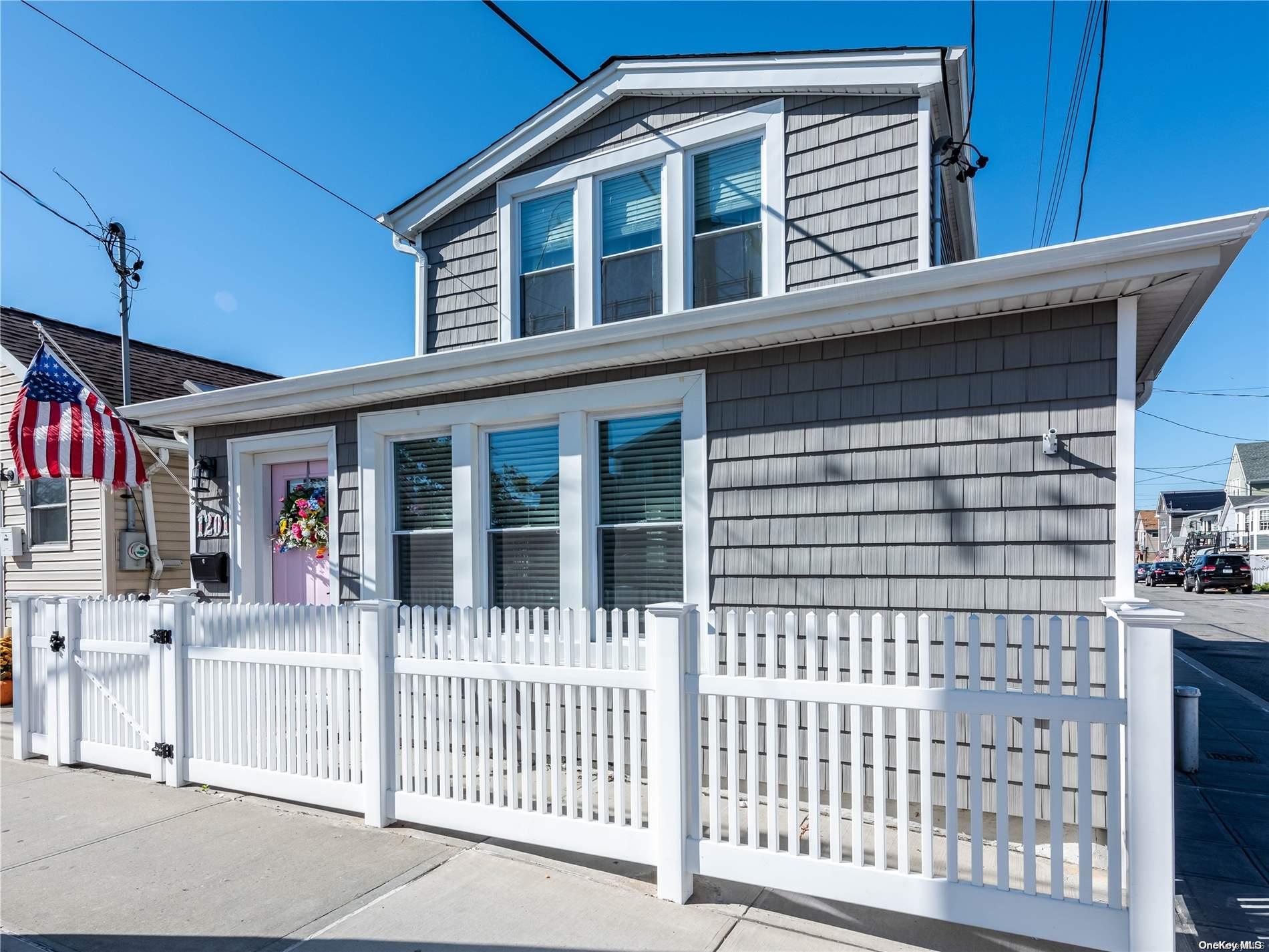 a front view of a house with a porch