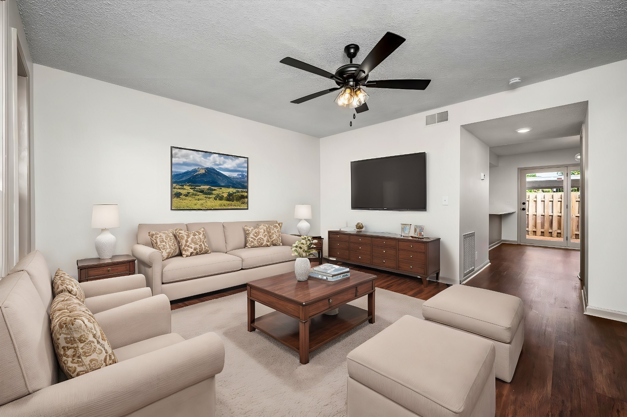 a living room with furniture and a flat screen tv