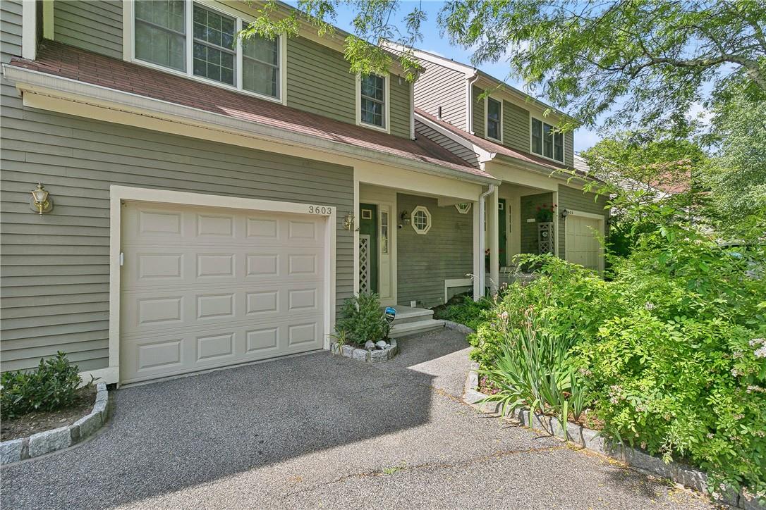 View of front of property featuring a garage