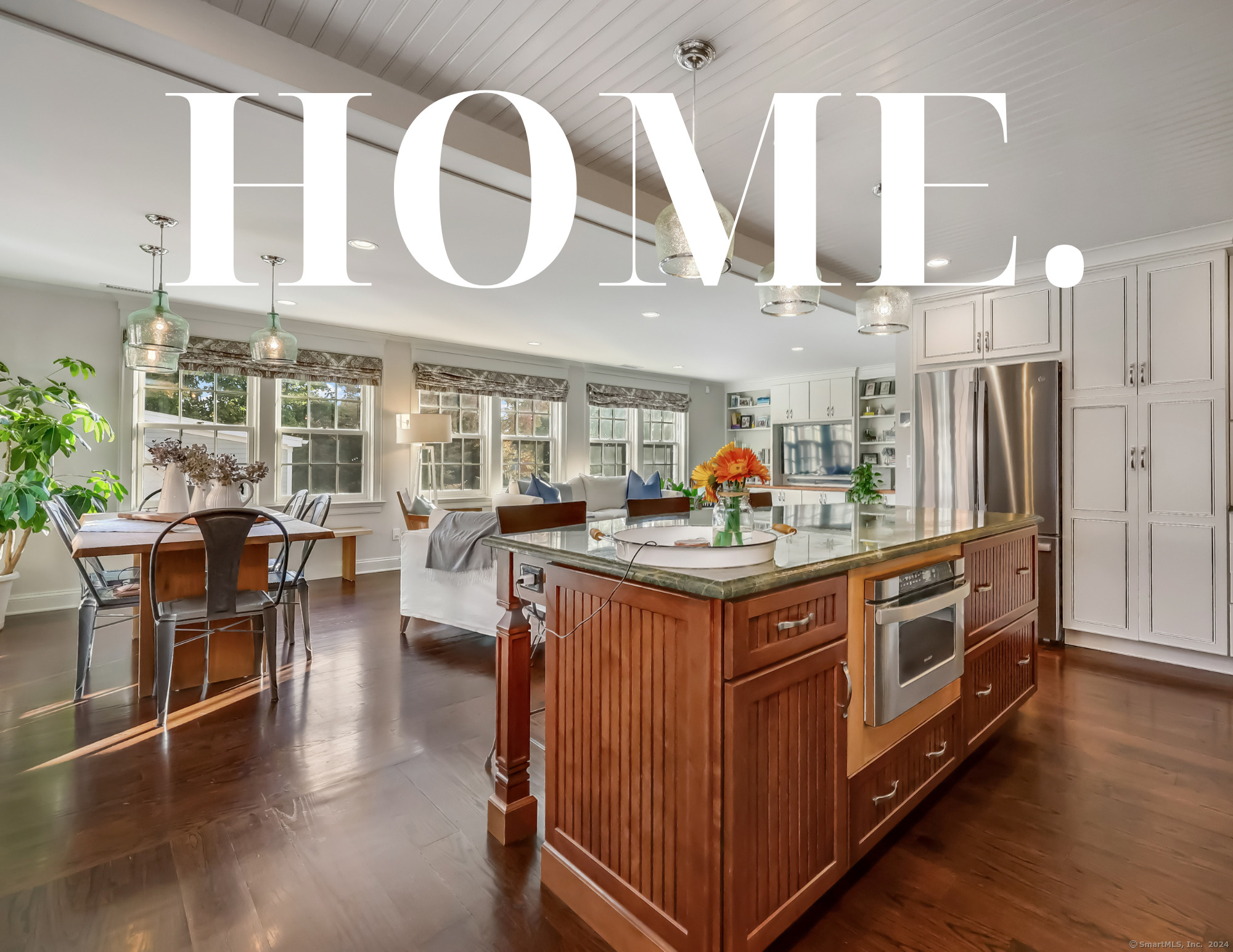 a kitchen with stainless steel appliances granite countertop a stove and cabinets