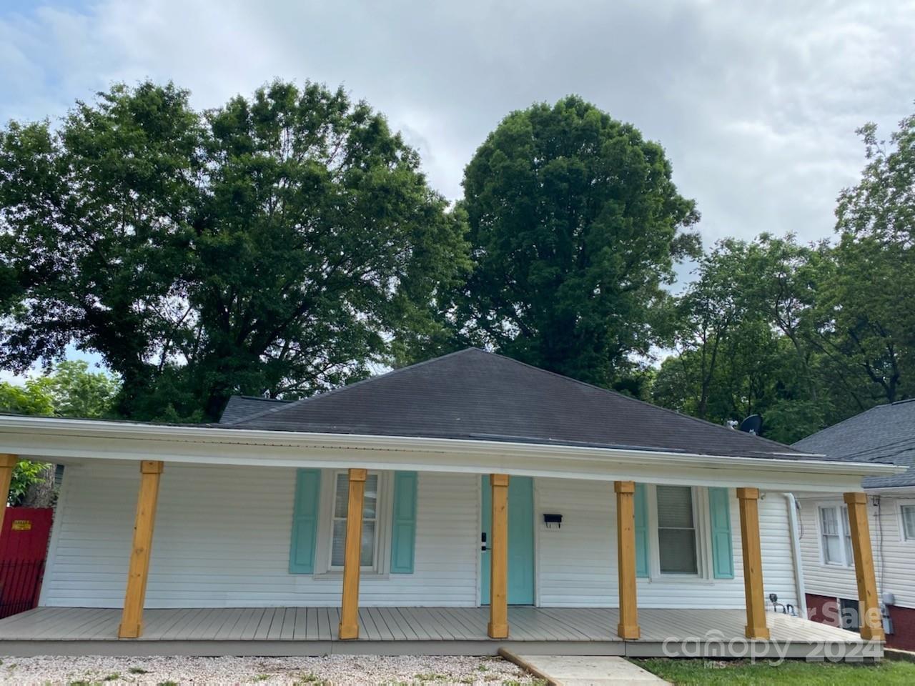 a house with trees in the background