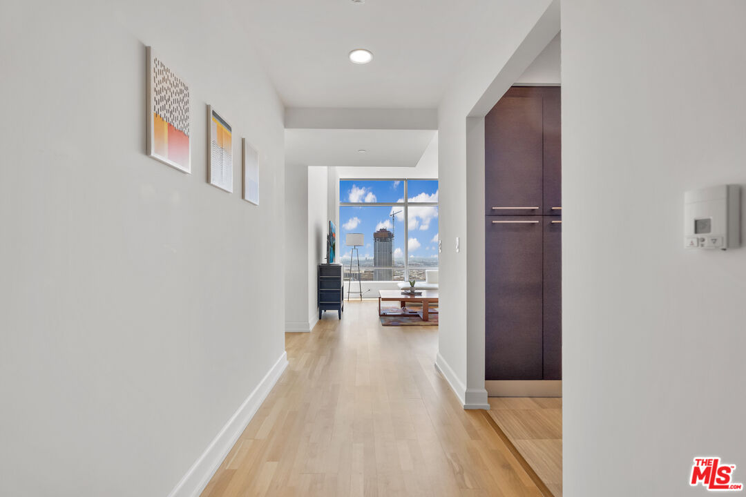 a view of a hallway view with wooden floor and furniture